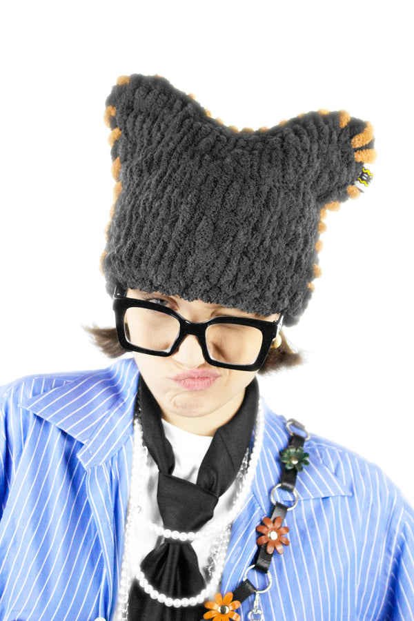 Charcoal Catnie shown from the front, highlighting its dark, minimal shape.